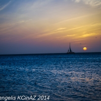 Lone Sail at Sunset